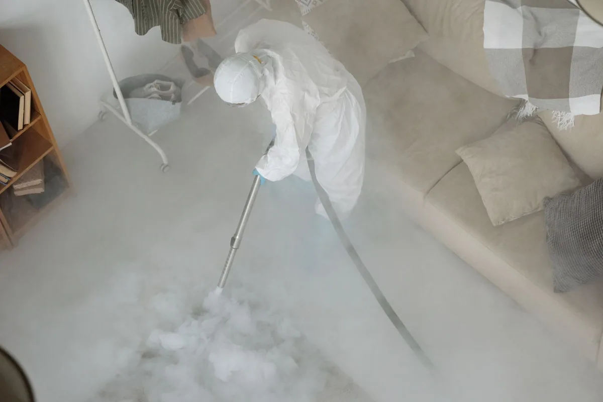 Biohazard cleanup technician in protective equipment, Union, MO